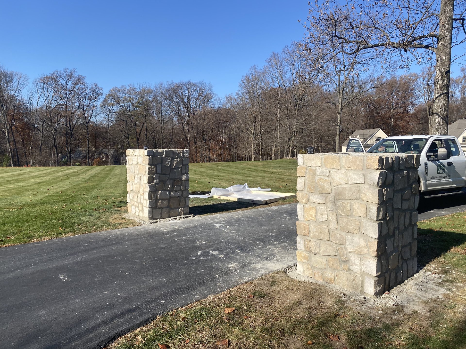 Completed driveway pillars with stone facade